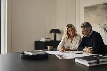 Married couple reviewing estate-planning documents for a Nevada SLAT