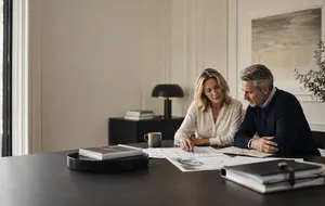 Married couple reviewing estate-planning documents for a Nevada SLAT