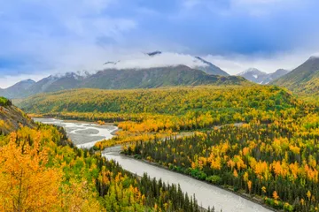 Alaska mountain valley and river representing a Nevada and Alaska trust comparison