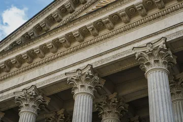 Classical stone columns representing the transfer of an existing trust into updated terms